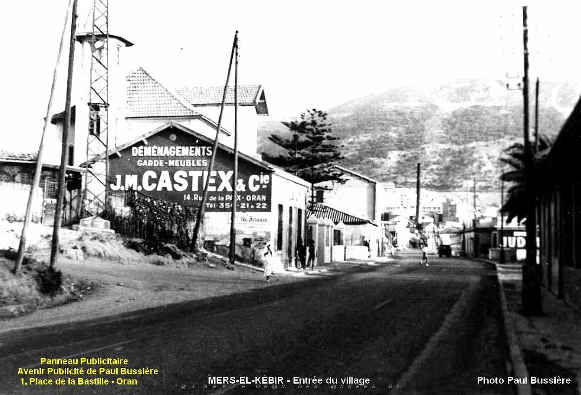 Mers-el-Kebir - Entree du village -Panneau pub Paul Bussiere.jpg